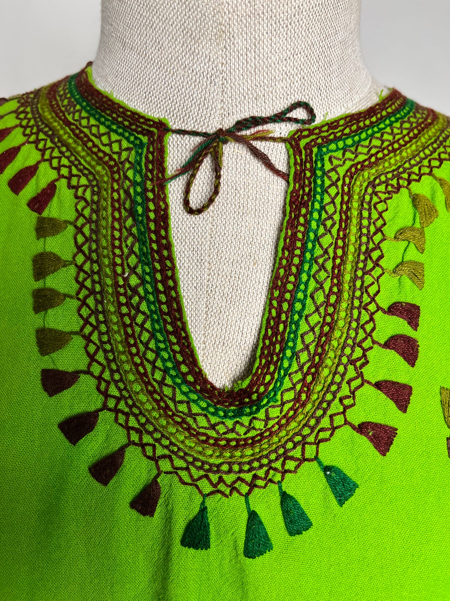 Green tribal embroidered top