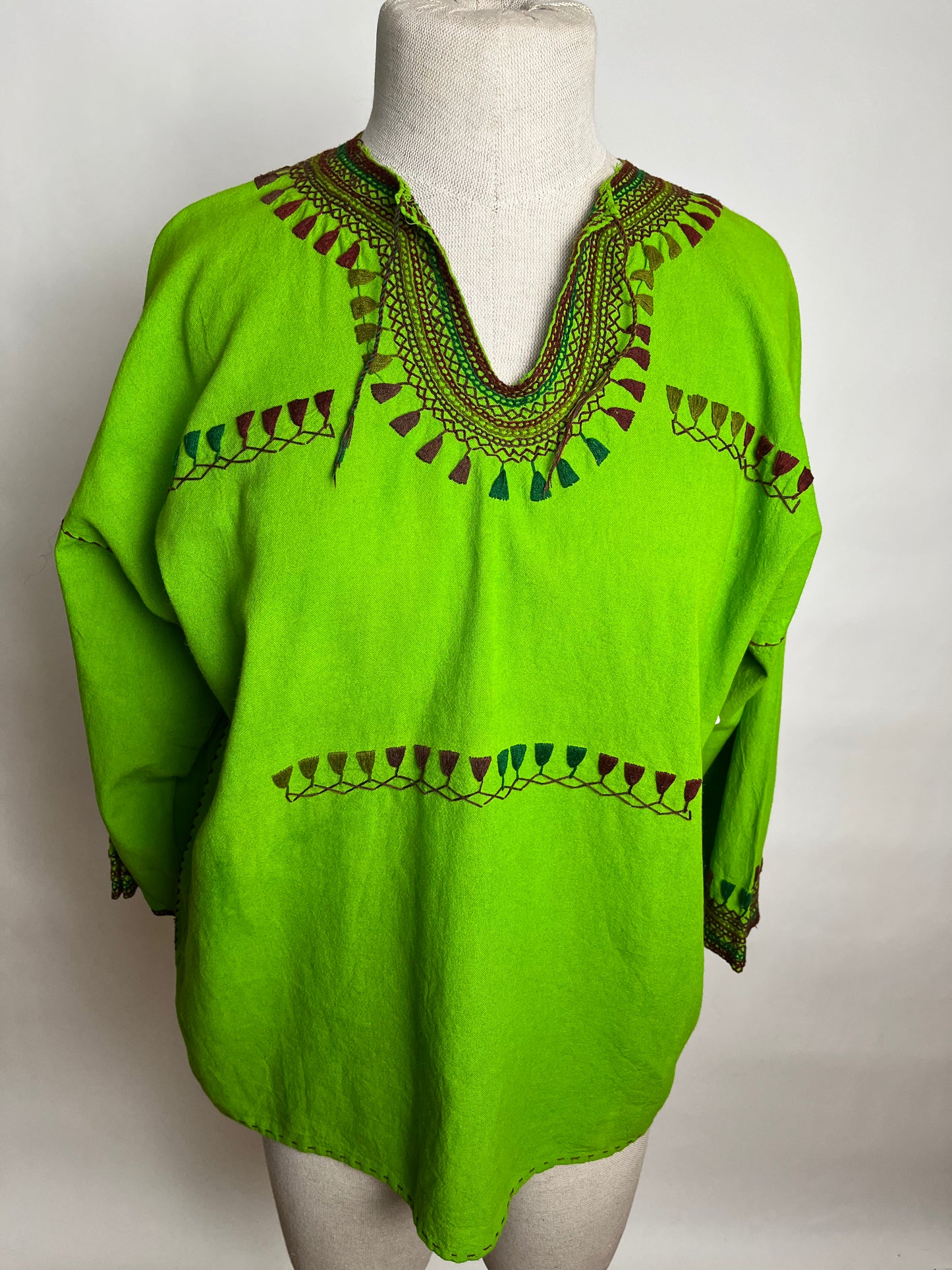 Green tribal embroidered top