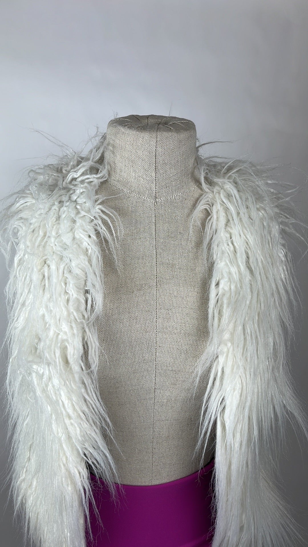 white faux fur winter vest