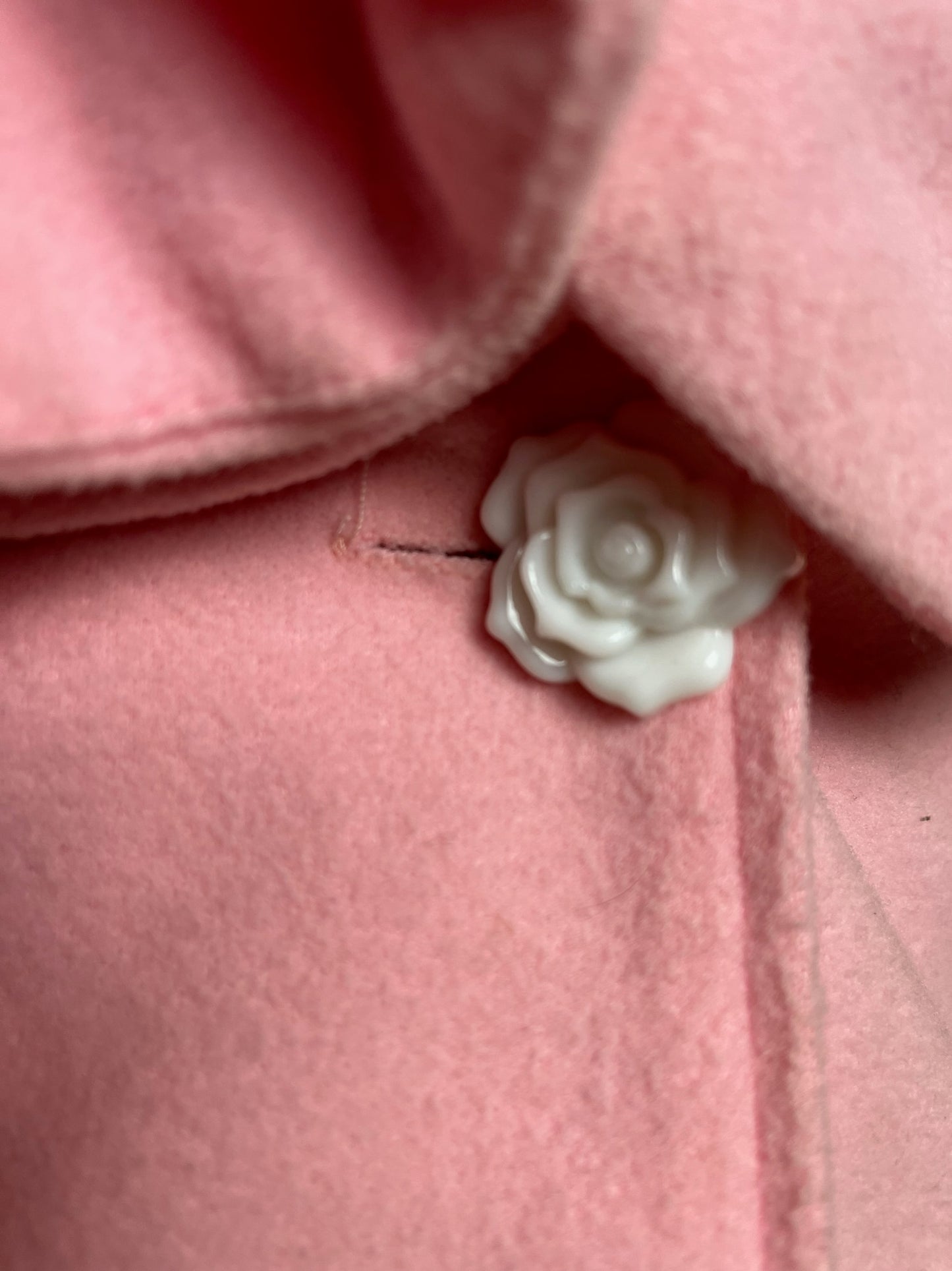 pink peacoat with flower buttons