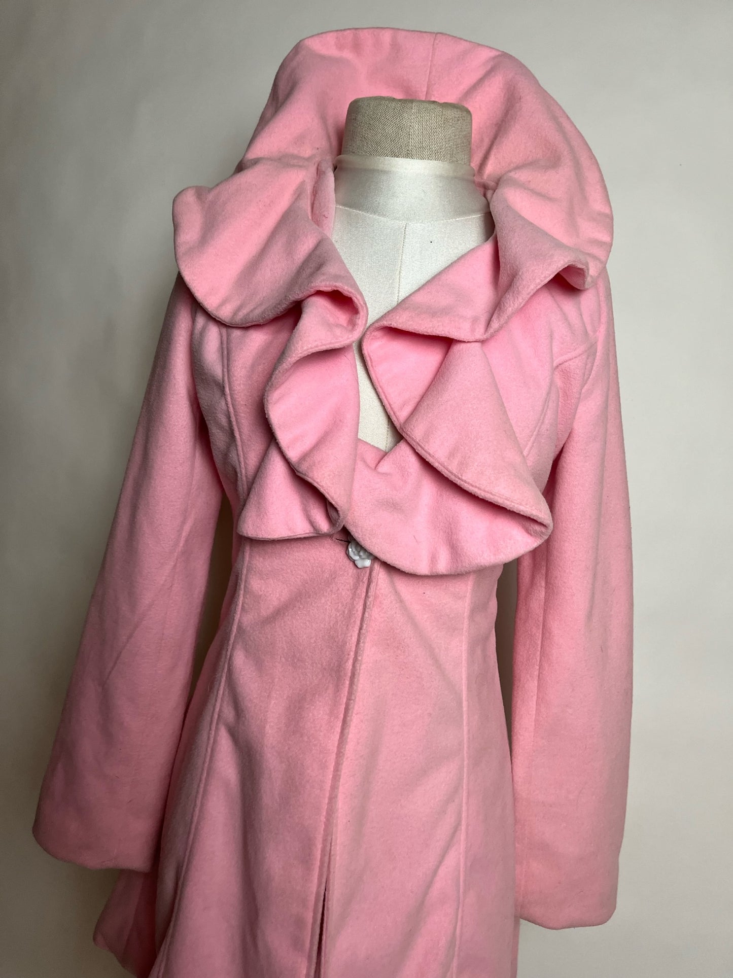 pink peacoat with flower buttons